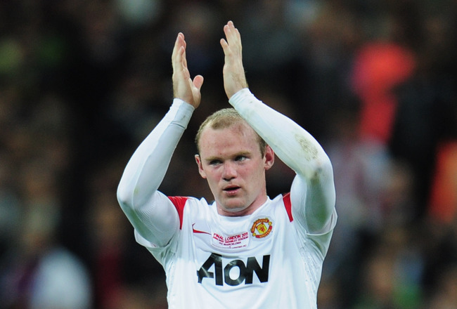 LONDON, ENGLAND - MAY 28:  Wayne Rooney of Manchester United applauds the fans after defeat during the UEFA Champions League final between FC Barcelona and Manchester United FC at Wembley Stadium on May 28, 2011 in London, England.  (Photo by Shaun Botterill/Getty Images)