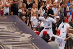 DENVER, CO - JULY 1:  Troy Tulowitzki #2 of the Colorado Rockies leaps into the dugout as he celebrates his two-run home run off of starting pitcher Danny Duffy #23 of the Kansas City Royals during the third inning at Coors Field on July 1, 2011 in Denver, Colorado.  (Photo by Justin Edmonds/Getty Images)