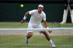 LONDON, ENGLAND - JULY 01:  Rafael Nadal of Spain returns a shot during his semifinal round match against Andy Murray of Great Britain on Day Eleven of the Wimbledon Lawn Tennis Championships at the All England Lawn Tennis and Croquet Club on July 1, 2011 in London, England.  (Photo by Michael Regan/Getty Images)