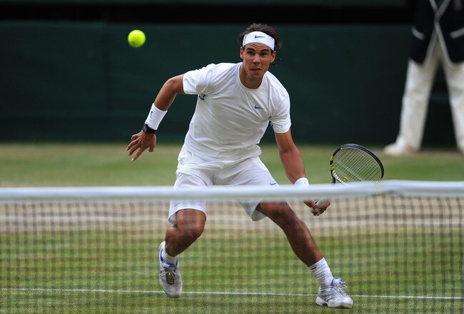 LONDON, ENGLAND - JULY 01:  Rafael Nadal of Spain returns a shot during his semifinal round match against Andy Murray of Great Britain on Day Eleven of the Wimbledon Lawn Tennis Championships at the All England Lawn Tennis and Croquet Club on July 1, 2011 in London, England.  (Photo by Michael Regan/Getty Images)