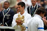 LONDON, ENGLAND - JULY 03:  Novak Djokovic of Serbia holds the championship trophy after winning his final round Gentlemen's match against Rafael Nadal of Spain on Day Thirteen of the Wimbledon Lawn Tennis Championships at the All England Lawn Tennis and Croquet Club on July 3, 2011 in London, England.  (Photo by Julian Finney/Getty Images)