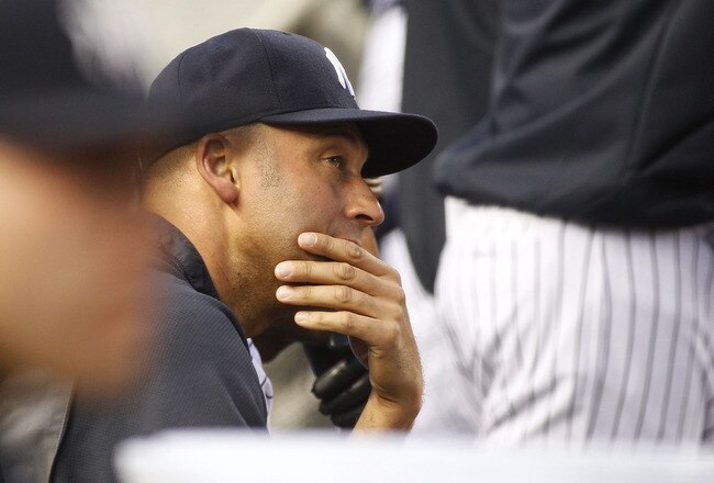 NEW YORK - JUNE 14:  Derek Jeter #2 of the New York Yankees looks on from the bench shortly after being placed on the 15 day disable list during the game against the Texas Rangers on June 14, 2011 at Yankee Stadium in the Bronx borough of New York City.  (Photo by Mike Stobe/Getty Images)