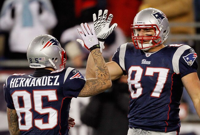 FOXBORO, MA - DECEMBER 06:  (L-R) Aaron Hernandez #85 and Rob Gronkowski #87 of the New England Patriots celebrate a play against the New York Jets at Gillette Stadium on December 6, 2010 in Foxboro, Massachusetts. The Patriots won 45-3. (Photo by Jim Rogash/Getty Images)