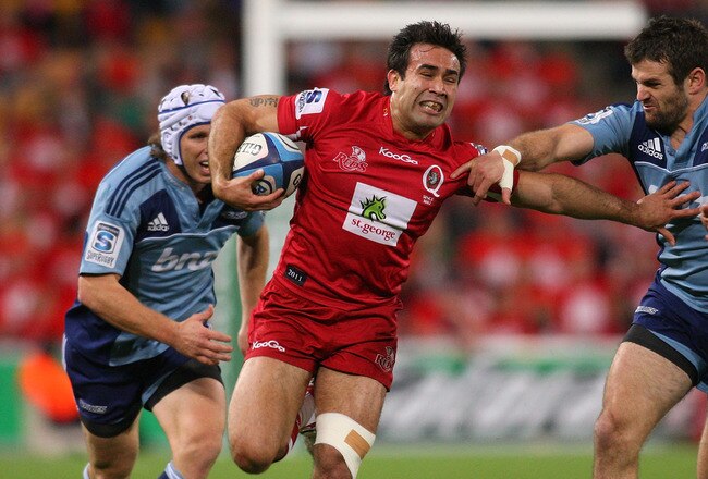 BRISBANE, AUSTRALIA - JULY 02: Rod Davies of the Reds runs in attack during the Super Rugby Semi Final match between the Reds and the Blues at Suncorp Stadium on July 2, 2011 in Brisbane, Australia.  (Photo by Jonathan Wood/Getty Images)