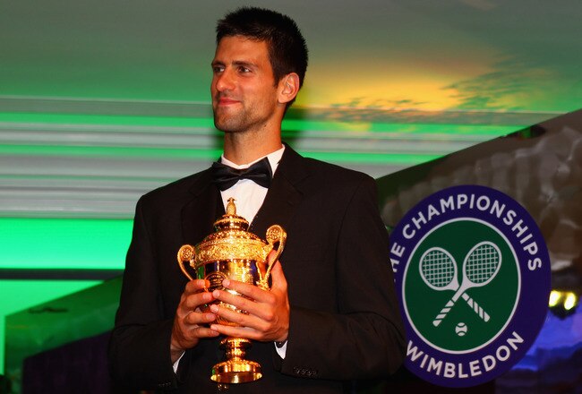 LONDON, ENGLAND - JULY 03:  Novak Djokovic of Serbia holds the mens trophy at the Wimbledon Championships 2011 Winners Ball at the InterContinental Park Lane Hotel on July 3, 2011 in London, England.  (Photo by Clive Brunskill/Getty Images)