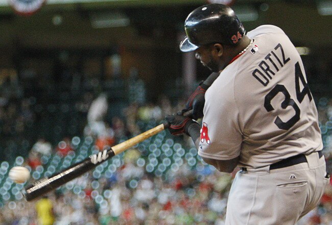 HOUSTON - JULY 02:  David Ortiz #34 of the Boston Red Sox flies out to left field in the sixth inning against the Houston Astros at Minute Maid Park on July 2, 2011 in Houston, Texas.  (Photo by Bob Levey/Getty Images)