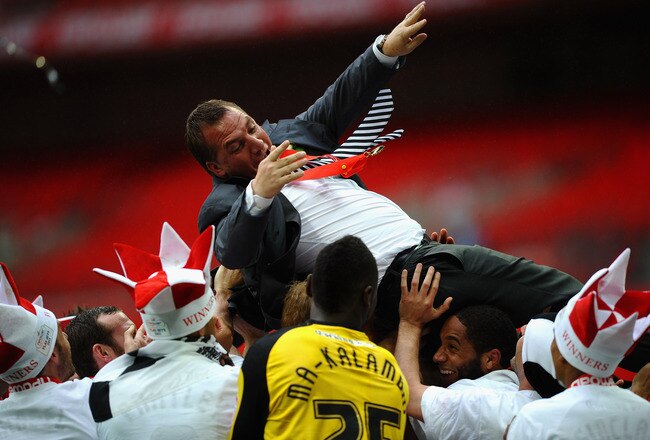 LONDON, ENGLAND - MAY 30:  Brendan Rogers of Swansea City is thrown in the air by his players after victory in the npower Championship Playoff Final between Reading and Swansea City at Wembley Stadium on May 30, 2011 in London, England.  (Photo by Laurence Griffiths/Getty Images)