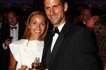 LONDON, ENGLAND - JULY 03:  Novak Djokovic of Serbia poses with the mens replica trophy with his girlfriend Jelena Ristic at the Wimbledon Championships 2011 Winners Ball at the InterContinental Park Lane Hotel on July 3, 2011 in London, England.  (Photo by Clive Brunskill/Getty Images)