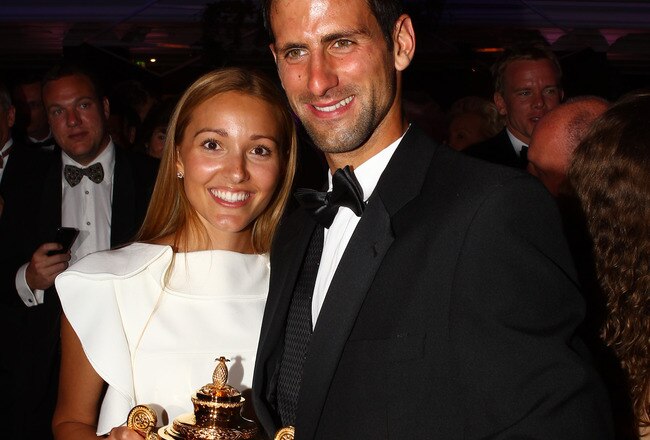 LONDON, ENGLAND - JULY 03:  Novak Djokovic of Serbia poses with the mens replica trophy with his girlfriend Jelena Ristic at the Wimbledon Championships 2011 Winners Ball at the InterContinental Park Lane Hotel on July 3, 2011 in London, England.  (Photo by Clive Brunskill/Getty Images)
