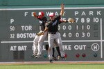 BOSTON, MA  - JULY 4:  Rajai Davis #11, Eric Thames #46, and Travis Snider #45 of the Toronto Blue Jays celebrate a 9-7 win over the Boston Red Sox at Fenway Park on July 4, 2011 in Boston, Massachusetts.  (Photo by Jim Rogash/Getty Images)