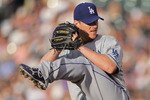 DENVER, CO - JUNE 10:  Starting pitcher Chad Billingsley #58 of the Los Angeles Dodgers delivers against the Colorado Rockies at Coors Field on June 10, 2011 in Denver, Colorado. Billingsley collected the loss as the Rockies defeated the Dodgers 6-5.  (Photo by Doug Pensinger/Getty Images)