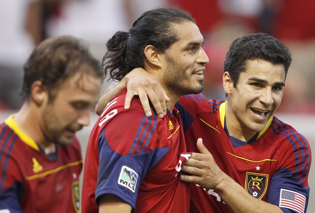 SANDY, UT - JULY 4: Fabian Espindola #7 of Real Salt Lake celebrates his game tying goal with Tony Beltran #2 and Ned Grabavoy #20 against the New England Revolution during the Second half of an MLS soccer game July 4, 2011 at Rio Tinto Stadium in Sandy, Utah. Real Salt Lake and the New England Revolution played to a 3-3 tie. (Photo by George Frey/Getty Images)