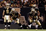 NEW ORLEANS - JANUARY 16:  (L-R) Offensive lineman Carl Nicks #77 and Jermon Bushrod #74 of the New Orleans Saints get set to pass protect as Drew Brees #9 and Reggie Bush #25 await the snap against the Arizona Cardinals during the NFC Divisional Playoff Game at Louisana Superdome on January 16, 2010 in New Orleans, Louisiana. The Saints won 45-14.  (Photo by Chris Graythen/Getty Images)