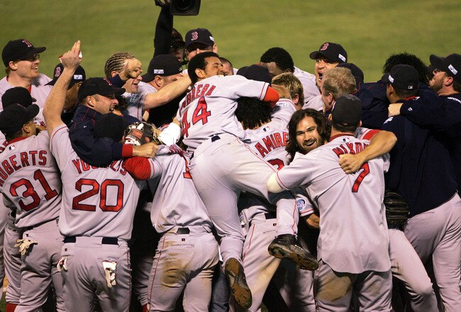 ST LOUIS - OCTOBER 27:  The Boston Red Sox celebrate after defeating the St. Louis Cardinals 3-0 to win game four of the World Series on October 27, 2004 at Busch Stadium in St. Louis, Missouri.  (Photo by Stephen Dunn/Getty Images)