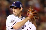 ARLINGTON, TX - NOVEMBER 01:  Starting pitcher Cliff Lee #33 of the Texas Rangers pitches against the San Francisco Giants in Game Five of the 2010 MLB World Series at Rangers Ballpark in Arlington on November 1, 2010 in Arlington, Texas. The Giants won 3-1.  (Photo by Ronald Martinez/Getty Images)