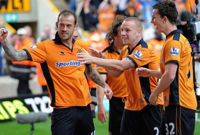WOLVERHAMPTON, ENGLAND - MAY 08: Steven Fletcher of Wolves celebrates with team mates Jamie O'Hara and Kevin Foley after scoring to make it 3-0 during the Barclays Premier League match between Wolverhampton Wanderers and West Bromwich Albion at Molineux on May 8, 2011 in Wolverhampton, England.  (Photo by Michael Regan/Getty Images)