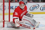 DETROIT, MI - JANUARY 2:  Chris Osgood #30 of the Detroit Red Wings turns a shot away in a game against the Philadelphia Flyers on January 2, 2011 at the Joe Louis Arena in Detroit, Michigan. The Flyers defeated the Wings 3-2. (Photo by Claus Anderzen/Getty Images)