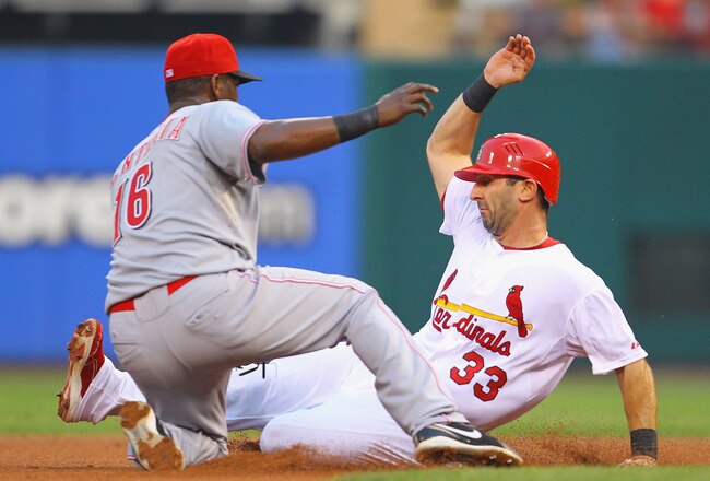 ST. LOUIS, MO - JULY 6: Daniel Descalso #33 of the St. Louis Cardinals is caught stealing second base against Edgar Renteria #16 of the Cincinnati Reds at Busch Stadium on July 6, 2011 in St. Louis, Missouri.  (Photo by Dilip Vishwanat/Getty Images)