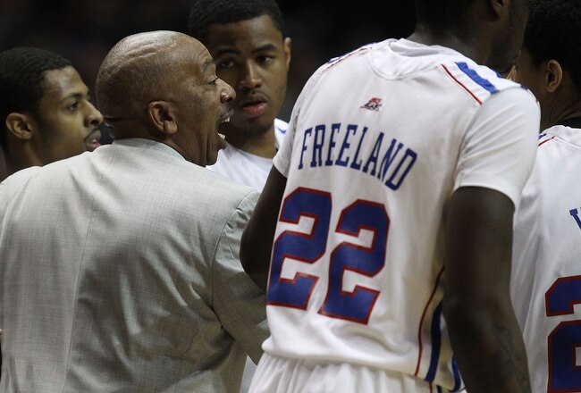 ROSEMONT, IL - FEBRUARY 19: Head coach Oliver Purnell of the DePaul Blue Demons gives instructions to his team including Tony Freeland #22 and Brandon Young #20 during a game against the Villanova Wildcats at the Allstate Arena on February 19, 2011 in Rosemont, Illinois. Villanova defeated DePaul 77-75 in overtime. (Photo by Jonathan Daniel/Getty Images)