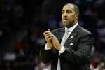 CHARLOTTE, NC - MARCH 18:  Head coach Lorenzo Romar of the Washington Huskies reacts in the second half while taking on the Georgia Bulldogs during the second round of the 2011 NCAA men's basketball tournament at Time Warner Cable Arena on March 18, 2011 in Charlotte, North Carolina.  (Photo by Kevin C. Cox/Getty Images)