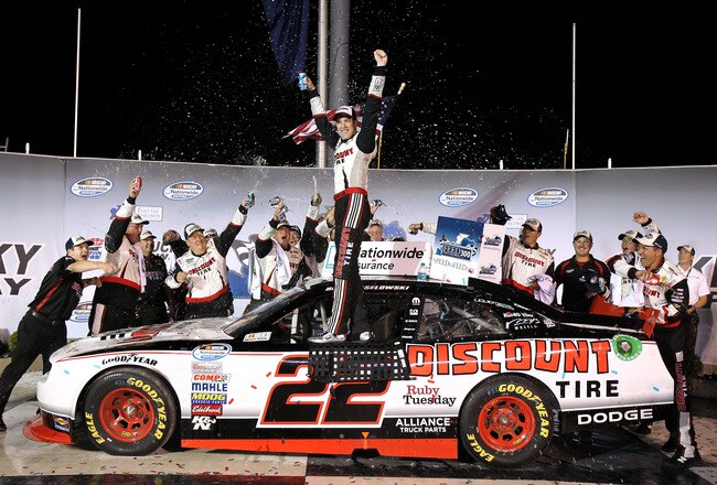 SPARTA, KY - JULY 08:  Brad Keselowski, driver of the #22 Discount Tire Dodge, celebrates in Victory Lane after winning the NASCAR Nationwide Series Feed the Children 300 at Kentucky Speedway on July 8, 2011 in Sparta, Kentucky.  (Photo by Tom Whitmore/Getty Images for NASCAR)