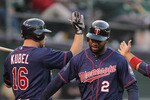 OAKLAND, CA - MAY 18:  Jason Kubel #16 congratulates Denard Span #2 and Alexi Casilla #12 of the Minnesota Twins after they both scored in the third inning against the Oakland Athletics at Oakland-Alameda County Coliseum on May 18, 2011 in Oakland, California.  (Photo by Ezra Shaw/Getty Images)