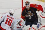 SUNRISE, FL - FEBRUARY 15: Tomas Vokoun #29 of the Florida Panthers braces for a shot from Matt Bradley #10 of the Washington Capitals on February 15, 2009 at the BankAtlantic Center in Sunrise, Florida.  (Photo by Bruce Bennett/Getty Images)