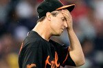BOSTON, MA - JULY 8:  Zach Britton #53 of the Baltimore Orioles reacts in the first inning against the Boston Red Sox at Fenway Park on July 8, 2011 in Boston, Massachusetts.  (Photo by Jim Rogash/Getty Images)