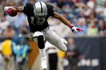 HOUSTON - OCTOBER 04:  Wide receiver Louis Murphy #18 of the Oakland Raiders jumps over a tackle by the Houston Texans at Reliant Stadium on October 4, 2009 in Houston, Texas.  (Photo by Ronald Martinez/Getty Images)