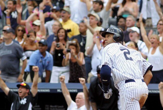 NEW YORK, NY - JULY 09:  Derek Jeter #2 of the New York Yankees rounds the bases after hitting a solo home run in the third inning for career hit 3000 while playing against the Tampa Bay Rays at Yankee Stadium on July 9, 2011 in the Bronx borough of New York City.  (Photo by Michael Heiman/Getty Images)