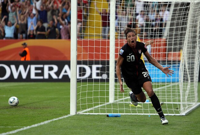 DRESDEN, GERMANY - JULY 10:  Abby Wambach of USA celebrates after scoring her team's equalizing goal during the FIFA Women's World Cup 2011 Quarter Final match between Brazil and USA at Rudolf-Harbig-Stadion on July 10, 2011 in Dresden, Germany.  (Photo by Martin Rose/Getty Images)