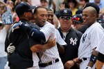 NEW YORK, NY - JULY 09:  Derek Jeter #2 of the New York Yankees celebrates at home with teammates Alex Rodriguez #13, Bartolo Colon #40 and Andruw Jones #18  after hitting a solo home run in the third inning for career hit 3000 while playing against the Tampa Bay Rays at Yankee Stadium on July 9, 2011 in the Bronx borough of New York City.  (Photo by Michael Heiman/Getty Images)