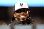 LOS ANGELES, CA - JULY 04:  Jose Reyes #7 of the New York Mets jokes wiht fans as he stands in the dugout during the game with the Los Angeles Dodgers on July 4, 2011 at Dodger Stadium in Los Angeles, California.  (Photo by Stephen Dunn/Getty Images)