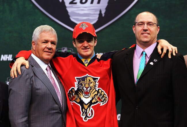 ST PAUL, MN - JUNE 24:  (L-R) General Manager Dale Tallon of the Florida Panthers, third overall pick Jonathan Huberdeau by the Florida Panthers and Director of Scouting Scott Luce of the Florida Panthers stand at the podium for a photo during day one of the 2011 NHL Entry Draft at Xcel Energy Center on June 24, 2011 in St Paul, Minnesota.  (Photo by Bruce Bennett/Getty Images)