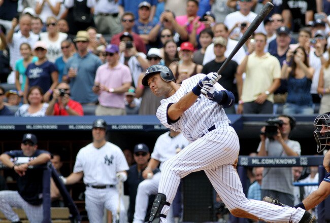 NEW YORK, NY - JULY 09:  Derek Jeter #2 of the New York Yankees hits a solo home run in the third inning for career hit 3000 while playing against the Tampa Bay Rays at Yankee Stadium on July 9, 2011 in the Bronx borough of New York City.  (Photo by Michael Heiman/Getty Images)
