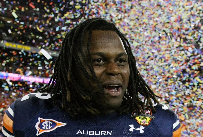 GLENDALE, AZ - JANUARY 10:  Kenneth Carter #92 of the Auburn Tigers celebrates the Tigers 22-19 victory against the Oregon Ducks in the Tostitos BCS National Championship Game at University of Phoenix Stadium on January 10, 2011 in Glendale, Arizona.  (Photo by Jonathan Ferrey/Getty Images)