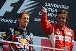 NORTHAMPTON, UNITED KINGDOM - JULY 10:  Race winner Fernando Alonso (R) of Spain and Ferrari celebrates on the podium with second placed Sebastian Vettel (L) of Germany and Red Bull Racing following the British Formula One Grand Prix at the Silverstone Circuit on July 10, 2011 in Northampton, England.  (Photo by Clive Mason/Getty Images)