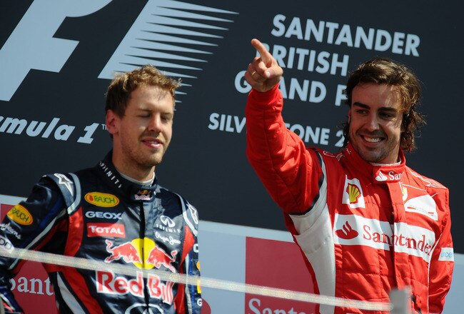 NORTHAMPTON, UNITED KINGDOM - JULY 10:  Race winner Fernando Alonso (R) of Spain and Ferrari celebrates on the podium with second placed Sebastian Vettel (L) of Germany and Red Bull Racing following the British Formula One Grand Prix at the Silverstone Circuit on July 10, 2011 in Northampton, England.  (Photo by Clive Mason/Getty Images)
