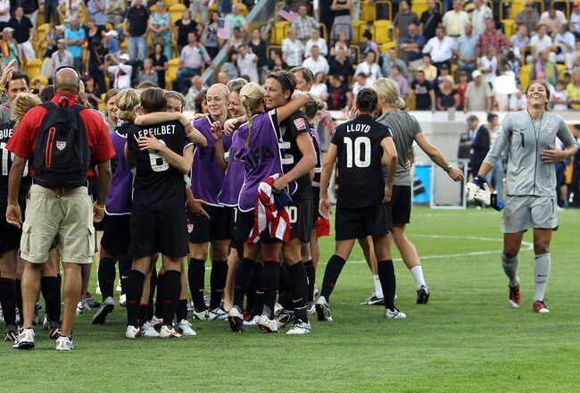 DRESDEN, GERMANY - JULY 10: The team of USA celebrate after the penalty shoot out during the FIFA Women's World Cup 2011 Quarter Final match between Brazil and USA at Rudolf-Harbig-Stadion on July 10, 2011 in Dresden, Germany.  (Photo by Martin Rose/Getty Images)