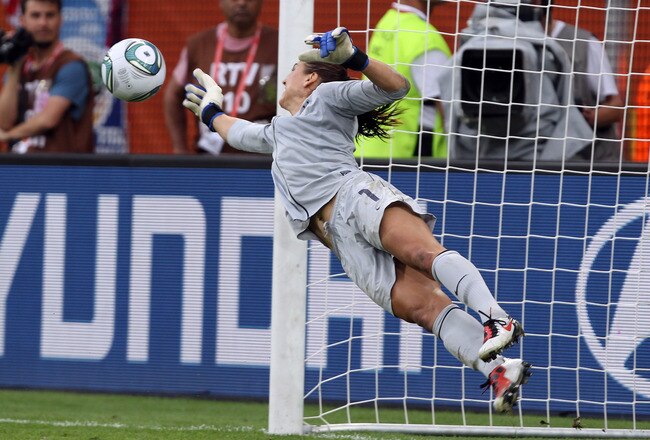 DRESDEN, GERMANY - JULY 10:  Hope Solo, goalkeeper of USA  saves a penalty during penalty shoot out during the FIFA Women's World Cup 2011 Quarter Final match between Brazil and USA at Rudolf-Harbig-Stadion on July 10, 2011 in Dresden, Germany.  (Photo by Martin Rose/Getty Images)