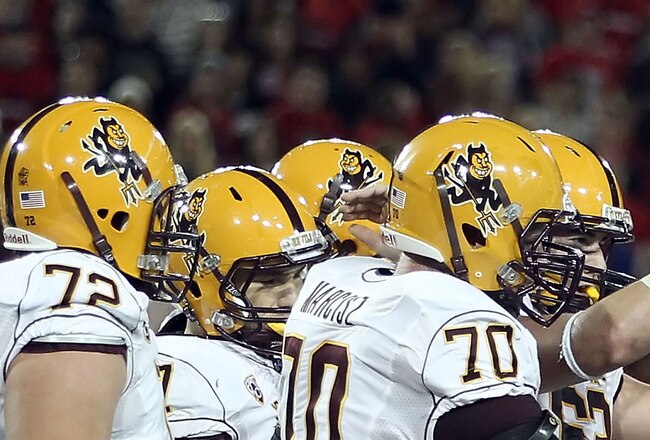 TUCSON, AZ - DECEMBER 02:  Kicker Thomas Weber #26 of the Arizona State Sun Devils is congratulated by teammates after kicking a 36 yard field goal against the Arizona Wildcats during the second quarter of the college football game at Arizona Stadium on December 2, 2010 in Tucson, Arizona.  (Photo by Christian Petersen/Getty Images)