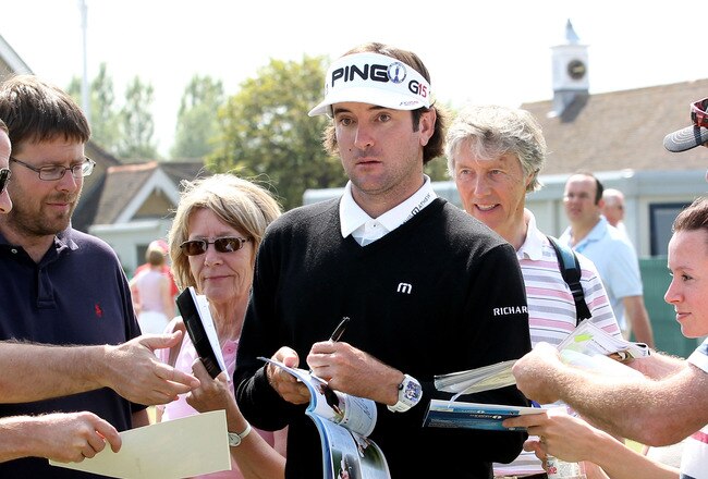 SANDWICH, ENGLAND - JULY 11:  Bubba Watson of USA signs autographs for the fans during the first practice round during The Open Championship, at Royal St. George's on July 11, 2011 in Sandwich, England. The 140th Open begins on July 14, 2011.  (Photo by Andrew Redington/Getty Images)