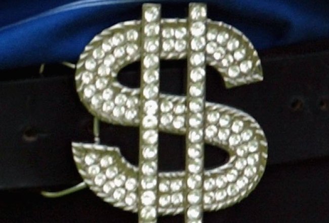 SINGAPORE - SEPTEMBER 10: Shingo Katayama of Japan wears a dollar sign buckle belt on course during the final round of the Singapore Open at the Sentosa Golf Club on September 10, 2006 in Singapore.   (Photo by Stanley Chou/Getty Images)