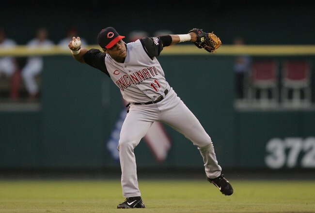 ST. LOUIS - JUNE 18:  Infielder Barry Larkin #11 of the Cincinnati Reds throws the ball against the St. Louis Cardinals during the game at Busch Stadium on June 18, 2004 in St. Louis, Missouri.  The Cardinals defeated the Reds 4-3.  (Photo by Dilip Vishwanat/Getty Images)