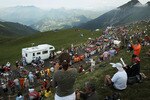 PAU, FRANCE - JULY 20: Thousands cheer on the peloton as they come to the top of the Col du Tourmalet during stage 16 of the Tour de France on July 20, 2010 in Pau, France. The stage, between Bagneres-de-Luchon and Pau, featured four major climbs including the Col du Tourmalet. French rider Pierrick Fedrigo won the stage while Alberto Contador retained the yellow jersey. The iconic bicycle race will include a total of 20 stages and will cover 3,642km before concluding in Paris on July 25.  (Photo by Spencer Platt/Getty Images)