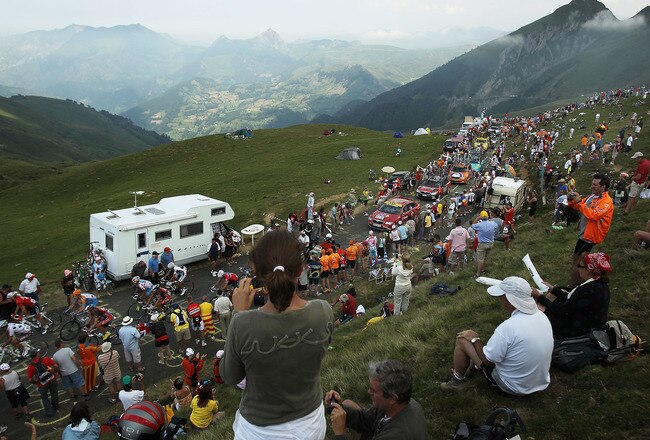 PAU, FRANCE - JULY 20: Thousands cheer on the peloton as they come to the top of the Col du Tourmalet during stage 16 of the Tour de France on July 20, 2010 in Pau, France. The stage, between Bagneres-de-Luchon and Pau, featured four major climbs including the Col du Tourmalet. French rider Pierrick Fedrigo won the stage while Alberto Contador retained the yellow jersey. The iconic bicycle race will include a total of 20 stages and will cover 3,642km before concluding in Paris on July 25.  (Photo by Spencer Platt/Getty Images)