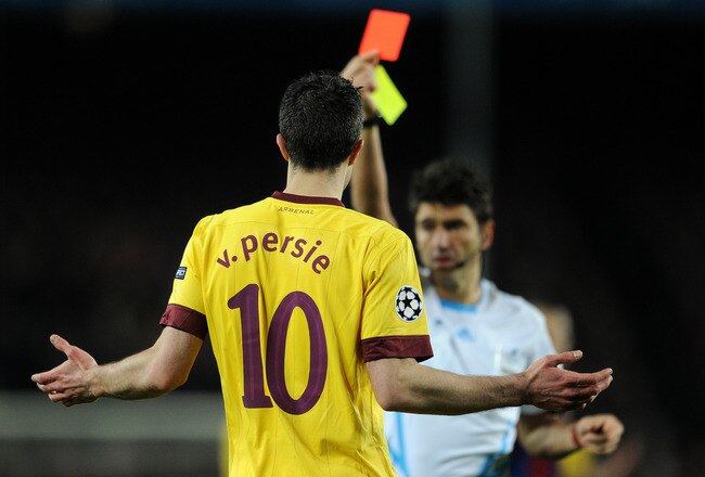 BARCELONA, SPAIN - MARCH 08:  Robin van Persie of Arsenal reacts as referee Massimo Busacca shows his a red card during the UEFA Champions League round of 16 second leg match between Barcelona and Arsenal on March 8, 2011 in Barcelona, Spain.  (Photo by Jasper Juinen/Getty Images)