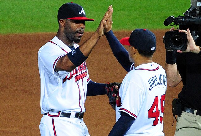 ATLANTA - JULY 1: Jair Jurrjens #49 and Jason Heyward #22 of the Atlanta Braves celebrate after the game against the Baltimore Orioles at Turner Field on July 1, 2011 in Atlanta, Georgia. (Photo by Scott Cunningham/Getty Images)
