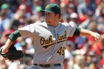 BOSTON, MA - JUNE 5: Brett Anderson #49 of the Oakland Athletics throws against the Boston Red Sox at Fenway Park on June 5, 2011 in Boston, Massachusetts.  (Photo by Jim Rogash/Getty Images)