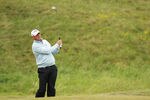 SANDWICH, ENGLAND - JULY 14:  Thomas Bjorn of Denmark hits an approach shot during the first round of The 140th Open Championship at Royal St George's on July 14, 2011 in Sandwich, England.  (Photo by Ross Kinnaird/Getty Images)